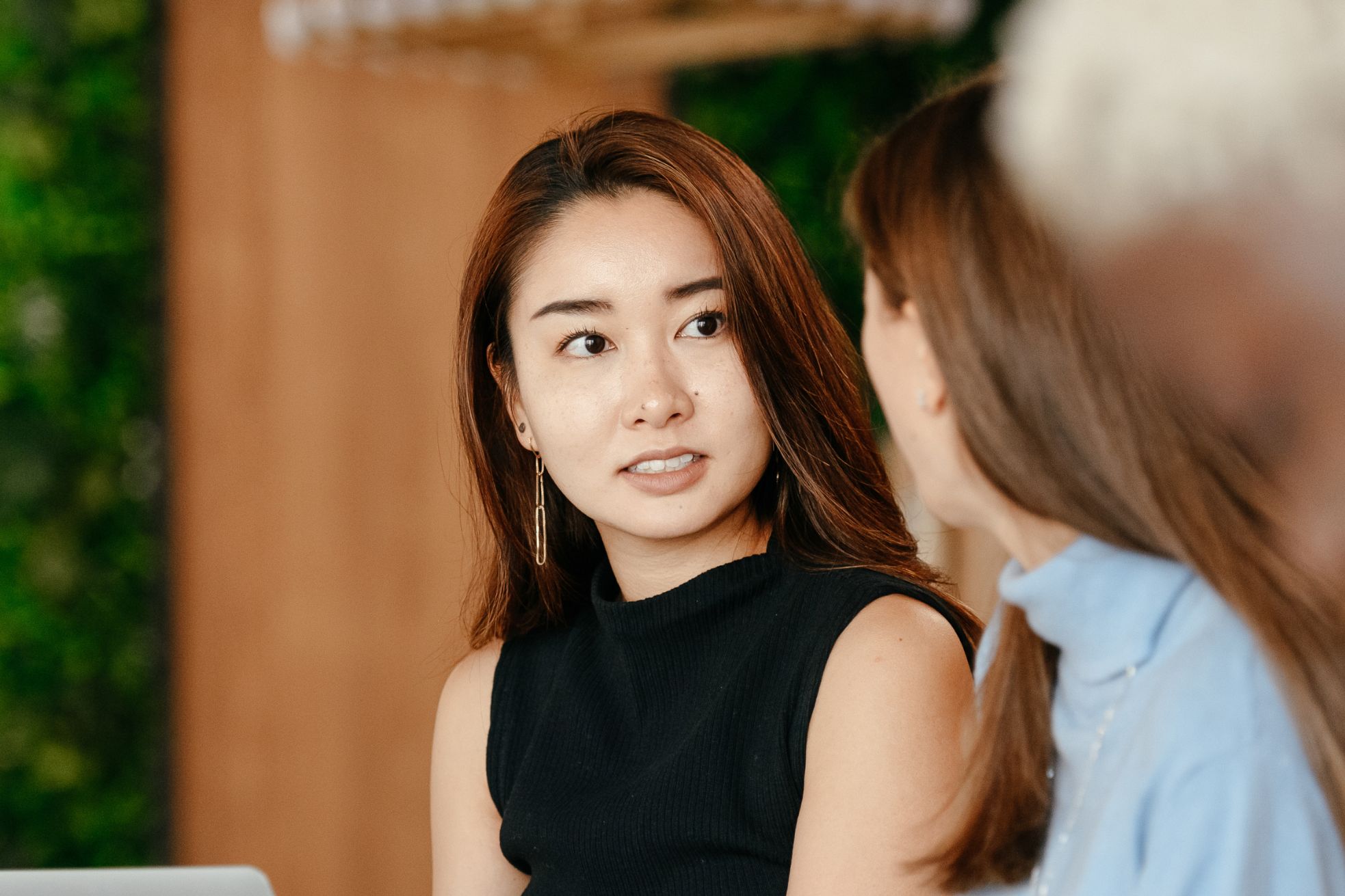a woman looking at another woman